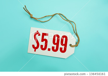 Price tag with "$5.99" is placed on blue background 136458161