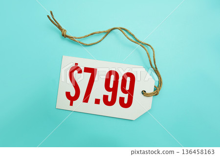 Price tag with "$7.99" is placed on blue background Price tag with "$7.99" is placed on blue background 136458163