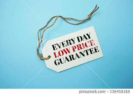 Price tag with "Every Day Low Price Guarantee" is placed on blue background 136458169