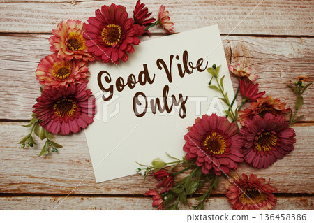 Good Vibe Only text with flowers bouquet on wooden background 136458386