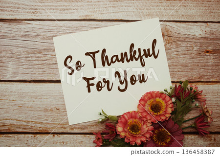 So Thankful For You text with flowers bouquet on wooden background 136458387
