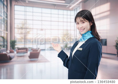 Smiling airport staff providing guidance Smiling airport staff providing guidance 136458480