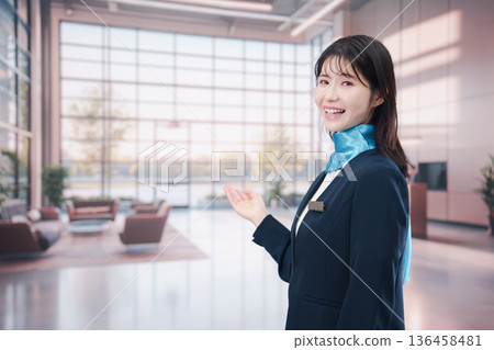 Smiling airport staff providing guidance Smiling airport staff providing guidance 136458481