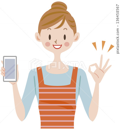 一位家庭主婦拿著智慧型手機，比出「OK」手勢 136458567