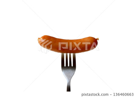 Wiener sausage on a fork on a white background 136460663
