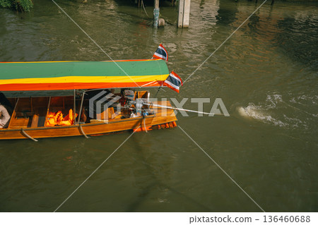 asia travel with people travel and take picture with large buddhist and beautiful temple with river at Bangkok Thailand in summer season asia travel with people travel and take picture with large buddhist and beautiful temple with river at Bangkok Thailand in summer season 136460688