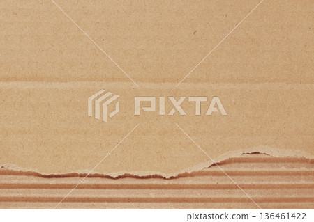 Brown cardboard sheet abstract background, texture of recycle paper box in old vintage pattern with ripped edges. Brown cardboard sheet abstract background, texture of recycle paper box in old vintage pattern with ripped edges. 136461422