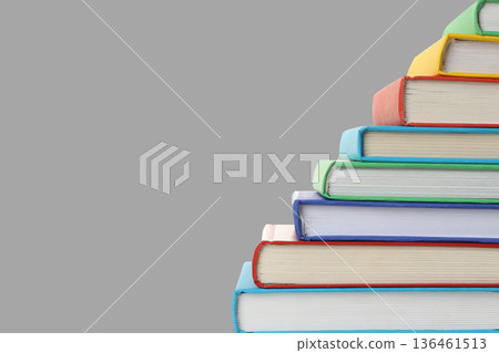 Stacked books sit neatly with space on the side for text Stacked books sit neatly with space on the side for text 136461513