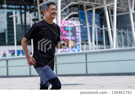 Middle-aged man jogging Middle-aged man jogging 136461742