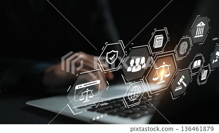 Digital Justice System Concept with Legal Icons Floating Above Laptop Keyboard in Dark Environment Gluon 136461879