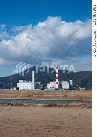 Kumamoto City's Seibu Environmental Plant (waste incineration facility) stands out against the blue sky Kumamoto City's Seibu Environmental Plant (waste incineration facility) stands out against the blue sky 136461961