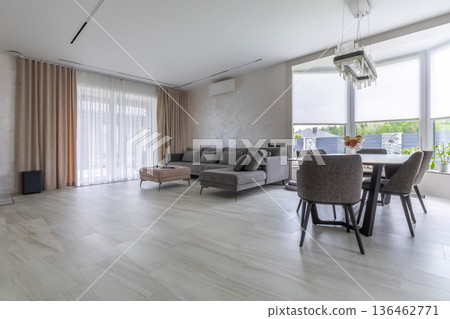 Open Plan Living Room and Dining Area with Large Windows 136462771