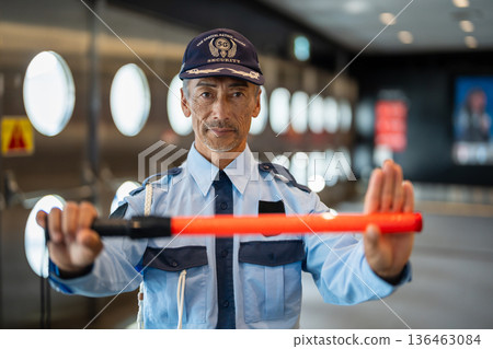 Security guard, senior man Security guard, senior man 136463084
