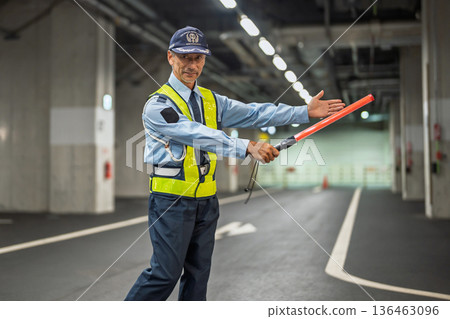 Security guard, traffic control officer, senior man 136463096