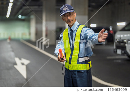 Security guard, traffic control officer, senior man 136463099