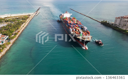 Export and import. Cargo business. Port of Miami. Cargo ship with container, aerial. Freight container on cargo vessel. Cargo ship vessel leaving port. Container ship. Global supply chain backbone Export and import. Cargo business. Port of Miami. Cargo ship with container, aerial. Freight container on cargo vessel. Cargo ship vessel leaving port. Container ship. Global supply chain backbone 136463361