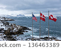 coastline of Greenland, Three flags on separate poles: the flag of Greenland, denmark and usa 136463389