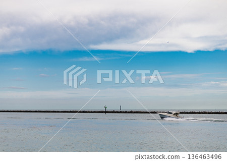 Yacht starts its sea trip. Seascape view of luxury yacht in sea. Luxury yacht in Miami. Summer vacation. Motor yacht boat in sea. Boat trip. Travel destination. Boat in the sea. Copy space 136463496