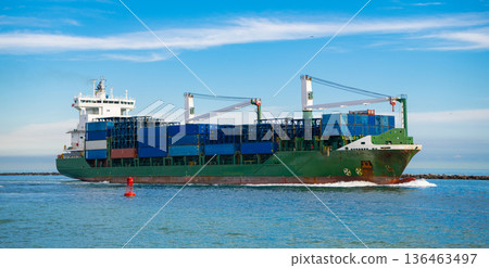 Cargo ship with container in Miami. Freight container loaded on cargo vessel in Miami. Aerial view cargo ship entering harbor. Container ship Cargo ship with container in Miami. Freight container loaded on cargo vessel in Miami. Aerial view cargo ship entering harbor. Container ship 136463497