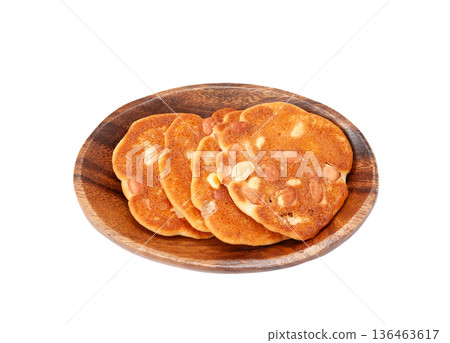 Peanut miso rice crackers on a plate [White background, cutout] 136463617