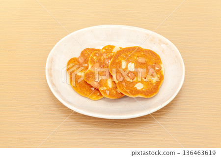 Peanut miso rice crackers on a plate Peanut miso rice crackers on a plate 136463619