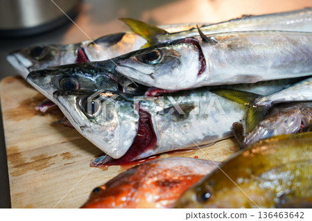 Fish on a chopping board 136463642
