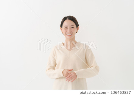 woman wearing white knit woman wearing white knit 136463827
