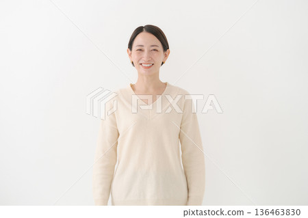 woman wearing white knit woman wearing white knit 136463830