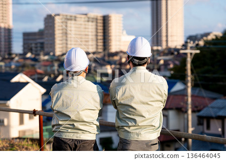 The back view of young and senior workers supporting the site The back view of young and senior workers supporting the site 136464045