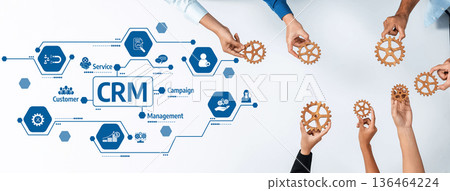 Collaborative Hands Holding Gears with CRM Concept on Table Representing Customer Relationship Management Strategy and Business Process Improvement. Amity Collaborative Hands Holding Gears with CRM Concept on Table Representing Customer Relationship Management Strategy and Business Process Improvement. Amity 136464224