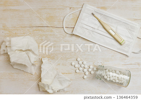 Used tissue, thermometer, mask and pills Used tissue, thermometer, mask and pills 136464359
