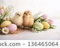 Easter still life with little chicks, eggs and spring flowers. Farm animals and holiday symbols. 136465064