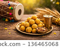 Baisakhi festival celebration with laddu sweets, wheat stalks and dhol drum. 136465068