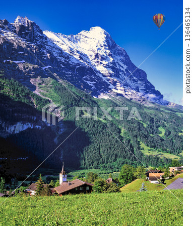Spectacular view of the North Face of the Eiger from the village of Grindelwald 136465134