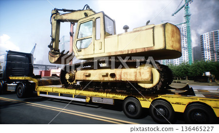 A trailer truck transporting excavator. Building and transport concept. 3d rendering. 136465227