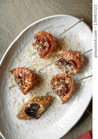 Bresaola skewers with honey ricotta appetizer Bresaola skewers with honey ricotta appetizer 136465523
