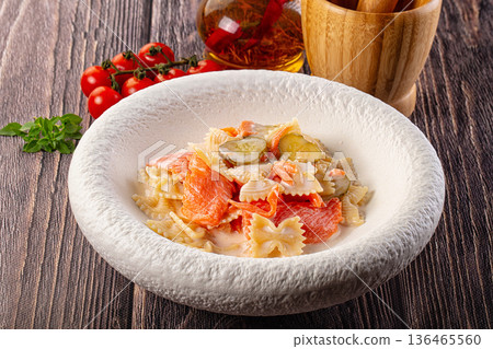 Italian pasta farfalle with salmon 136465560