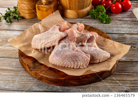 Fresh raw chicken wings over board Fresh raw chicken wings over board 136465579