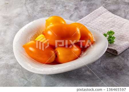 Sweet juicy ripe yellow tomato Sweet juicy ripe yellow tomato 136465597