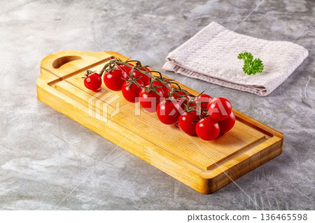 Ripe sweet cherry tomato branch 136465598