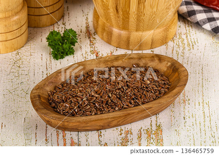 Brown flax seeds in the bowl Brown flax seeds in the bowl 136465759