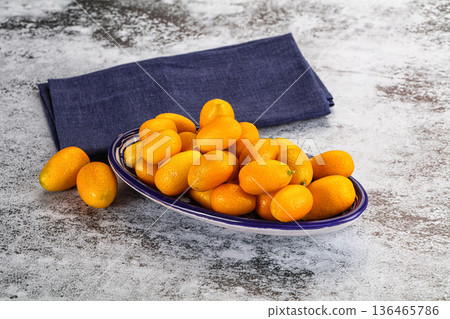 Sweet juicy tropical fruit kumquat Sweet juicy tropical fruit kumquat 136465786