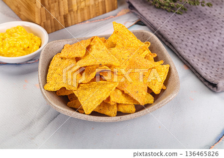 Corn nachos chips with cheese dip 136465826