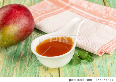 Sweet dessert orange mango puree Sweet dessert orange mango puree 136465845