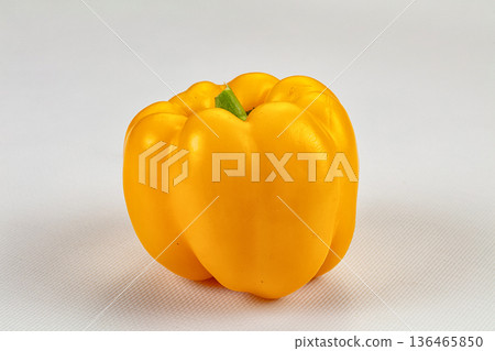 Ripe yellow sweet peppers on a dark textured background Ripe yellow sweet peppers on a dark textured background 136465850