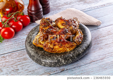 Baked chicken wings with spices 136465930