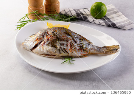 Baked dorada fish with spices Baked dorada fish with spices 136465990