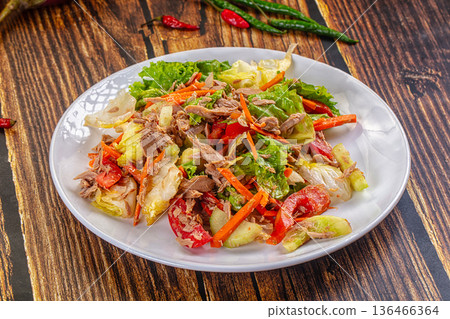 Fresh Tuna Salad with Vegetables in a Bowl on a Rustic Wooden Table 136466364