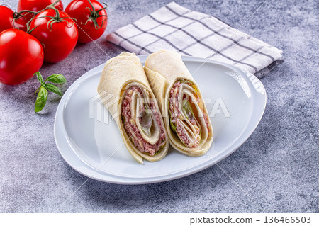 Wrap roll tortilla with ham and cheese 136466503
