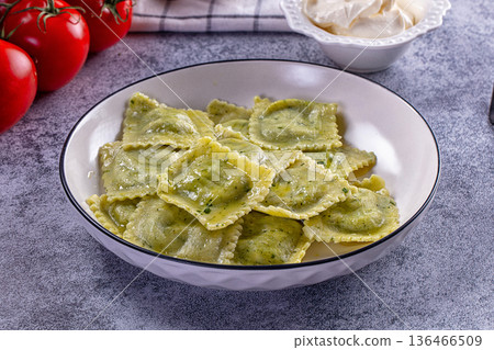 Italian dumplings ravioli with spinach 136466509